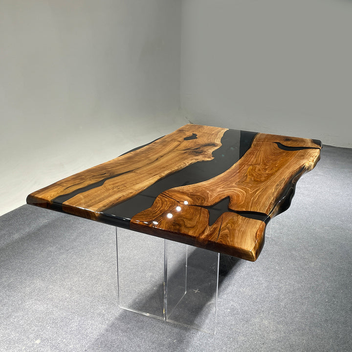 Black walnut river table with live edge and translucent black epoxy