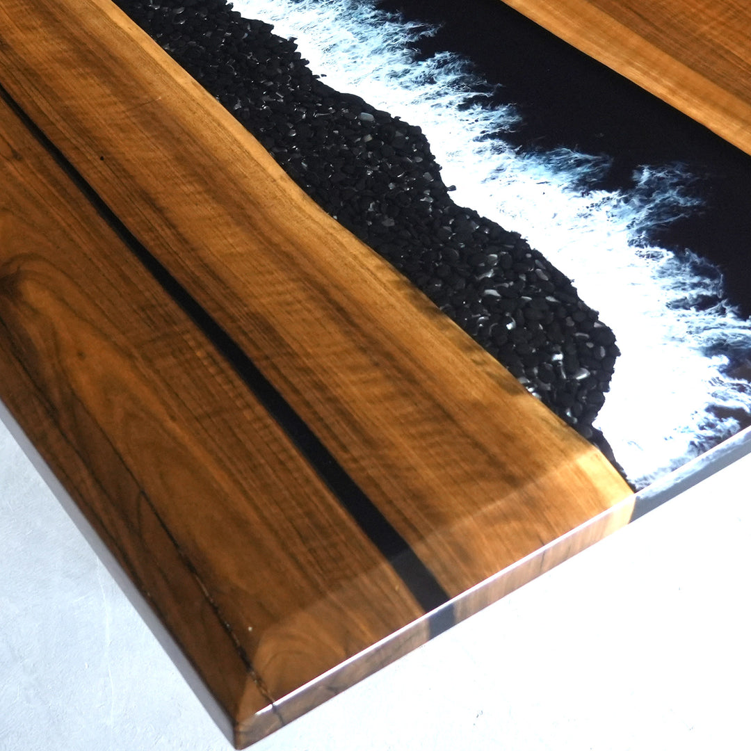 Black resin walnut table with embedded black stones