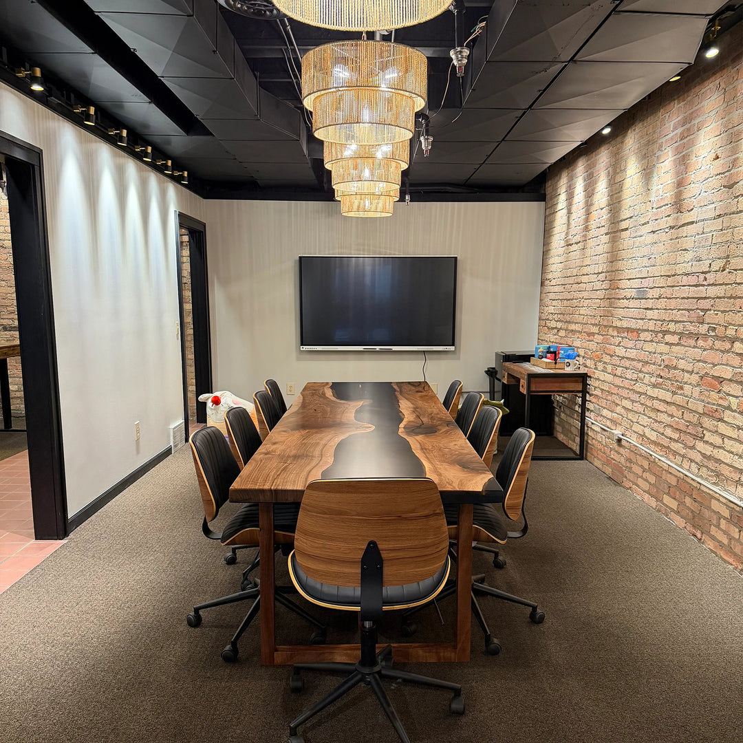 SeawaveTable black epoxy river table used in office meeting setup in Sturgis MI with industrial design