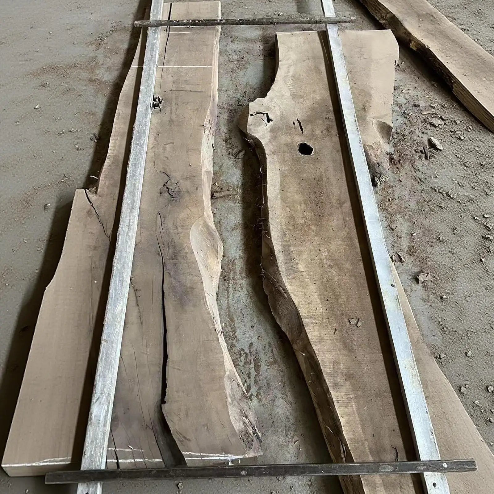 SeawaveTable black walnut slab selection for custom epoxy river dining table with stone and wave design in Chicago IL