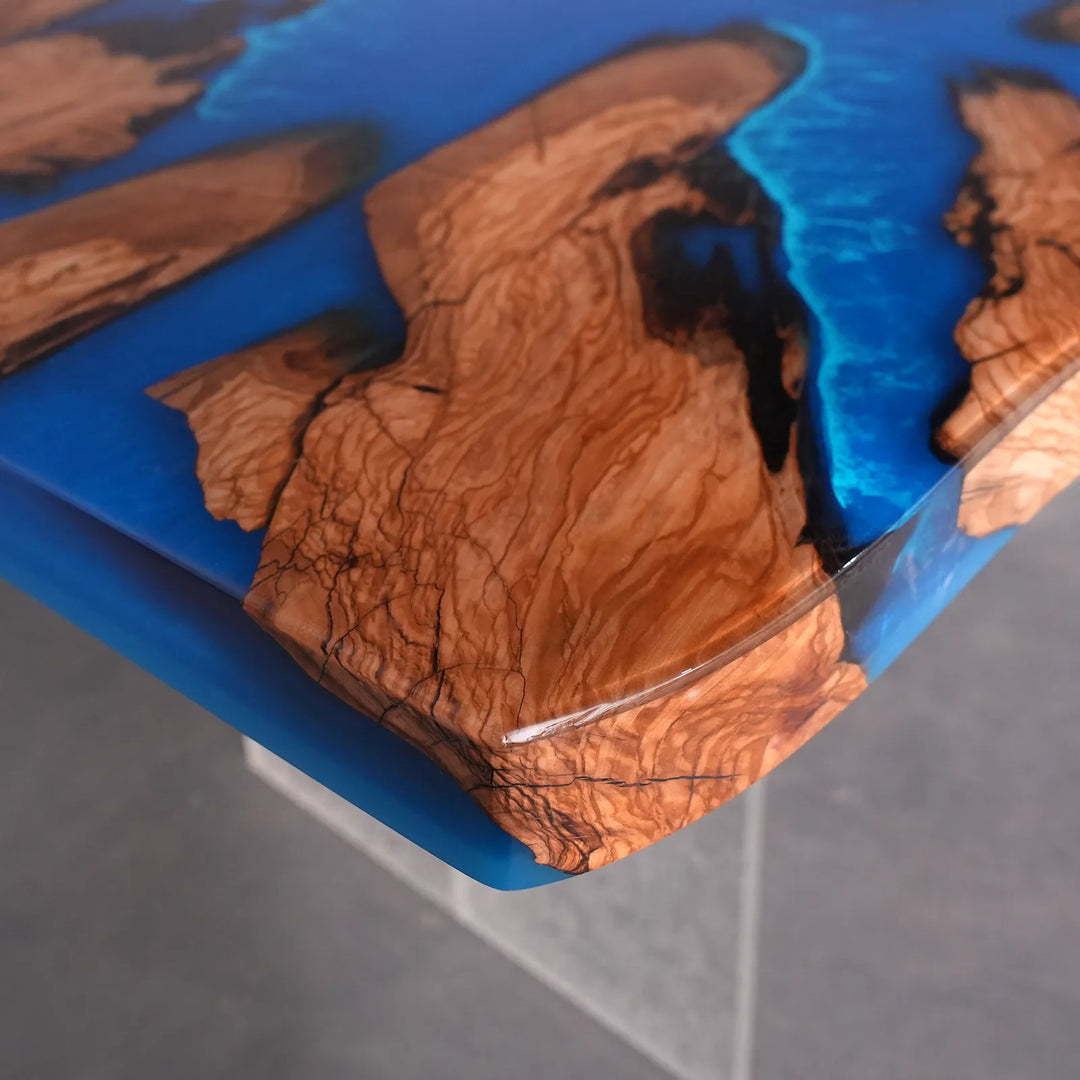 SeawaveTable high gloss epoxy river table surface with reflective finish and blue resin