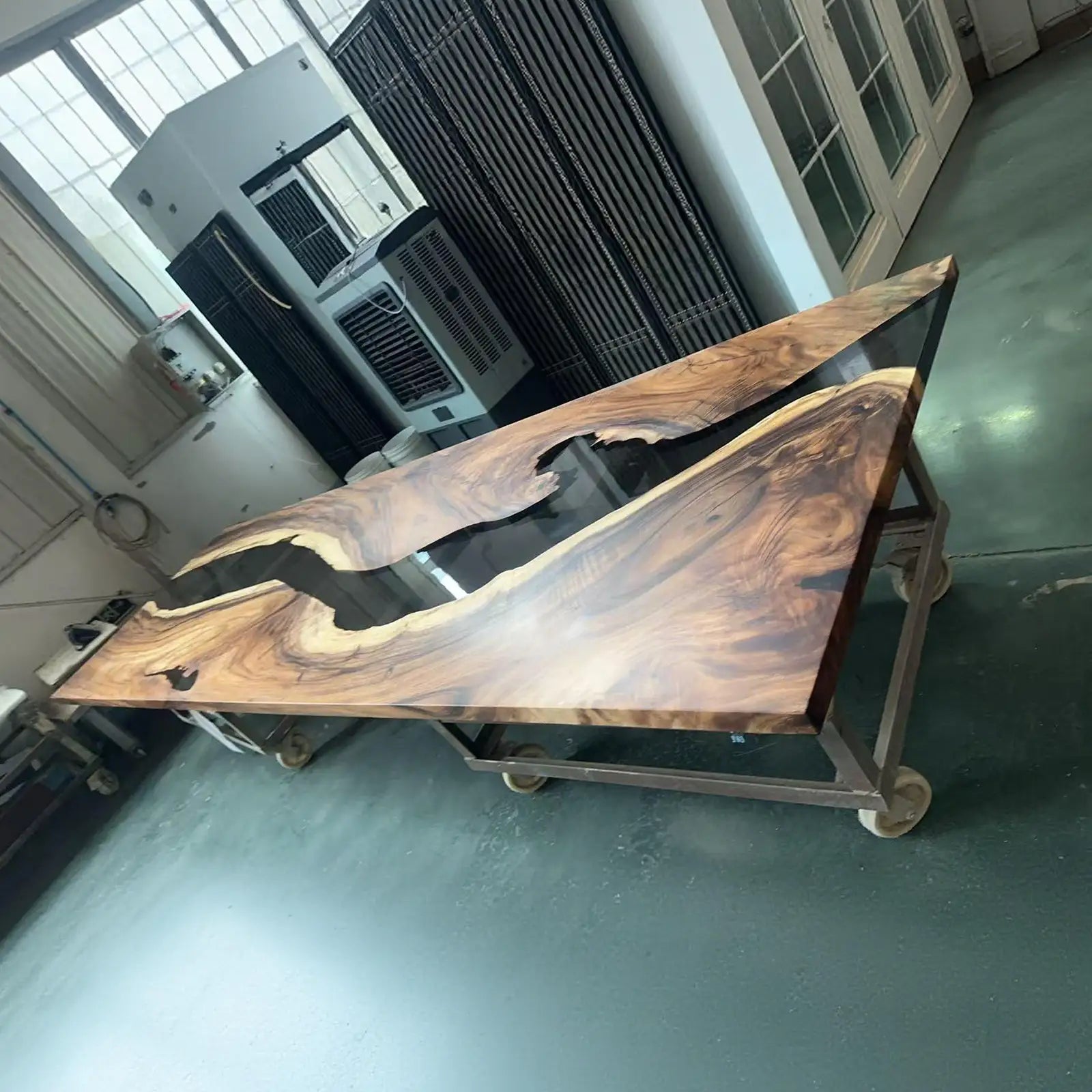 SeawaveTable large custom black walnut epoxy river table in banquet or meeting room setting 48x156 inch