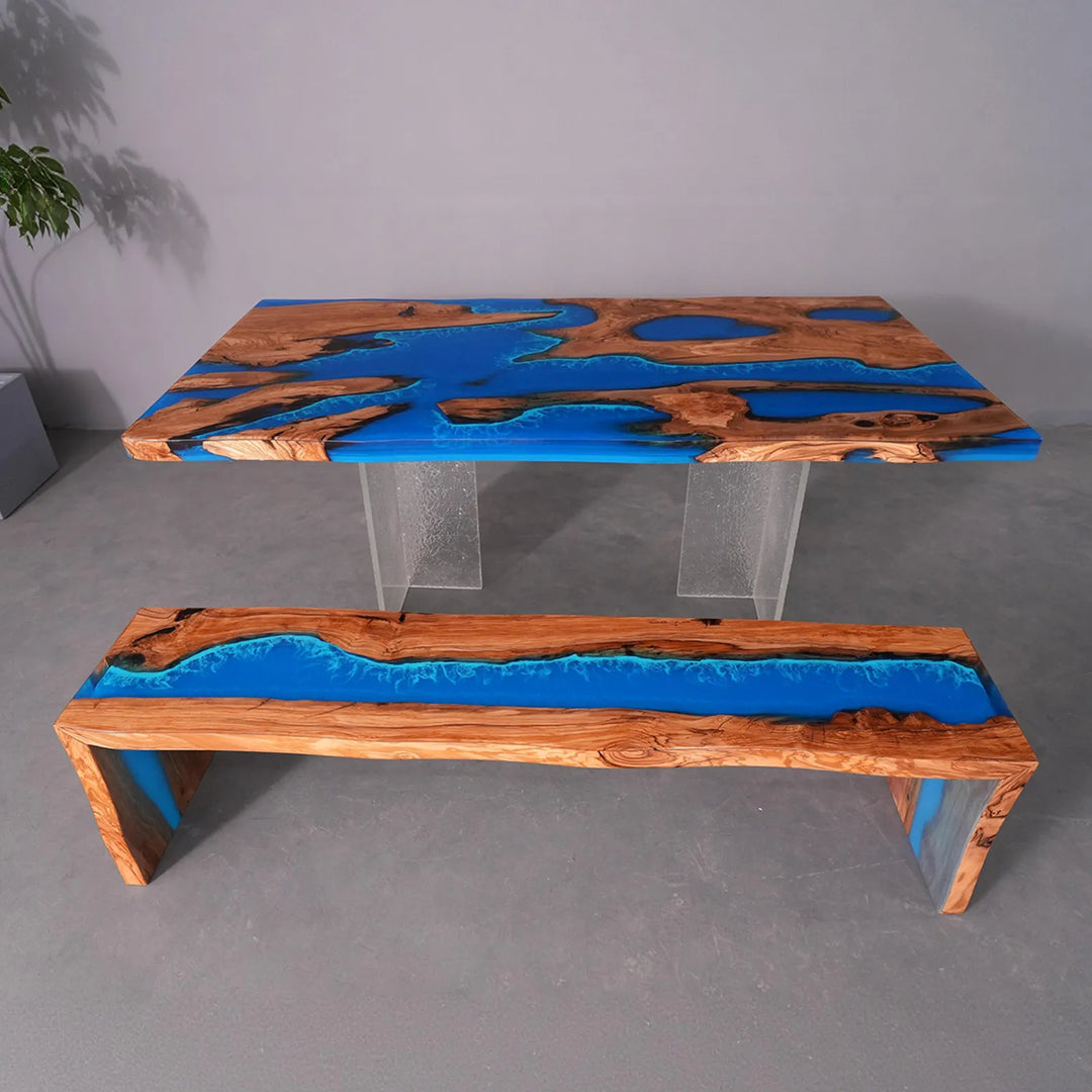 SeawaveTable live edge olive wood river table with ocean blue epoxy resin in modern dining room
