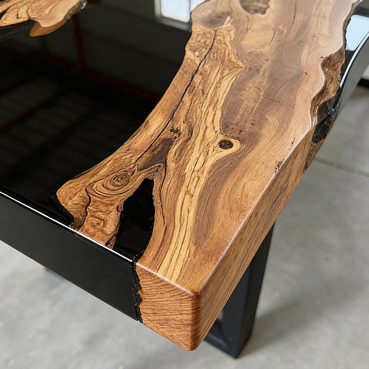 SeawaveTable olive wood black epoxy river table top view showing grain and resin flow