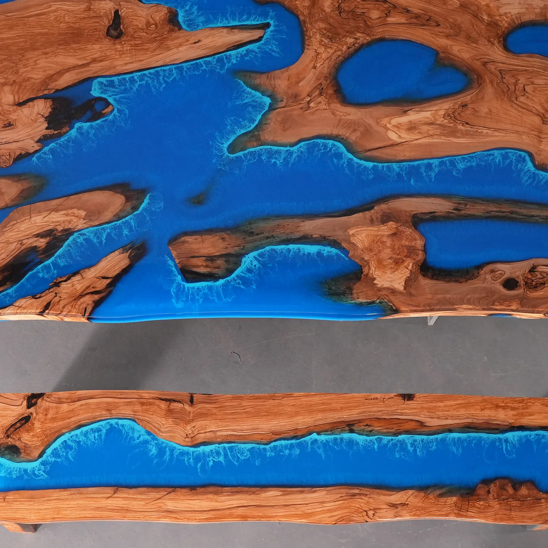 SeawaveTable olive wood blue resin table top view showing flowing wave pattern