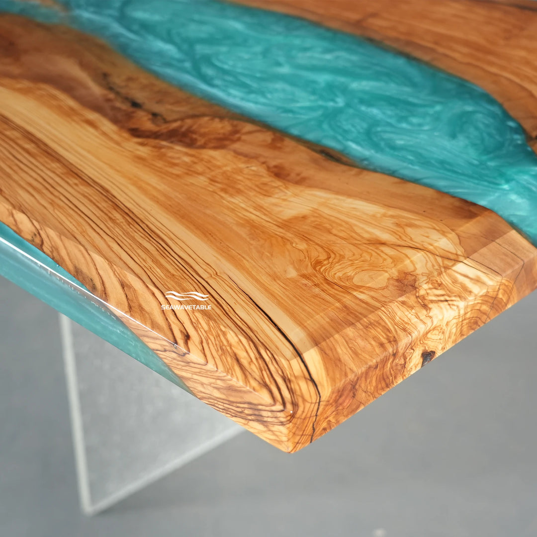 Turquoise tide epoxy color on olive wood table with blue green ocean tone resin