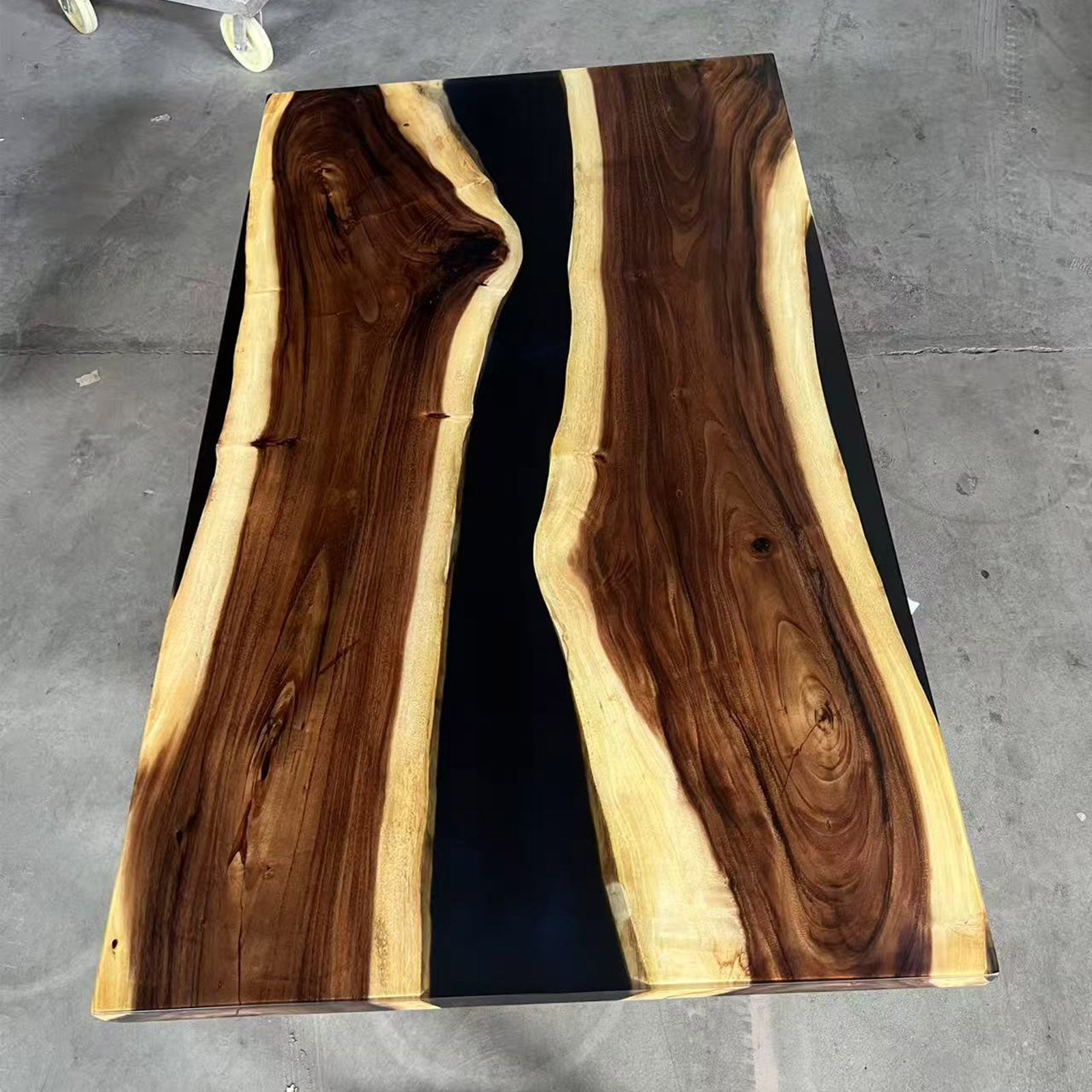 Modern solid walnut conference table with black epoxy river and premium handcrafted finish.