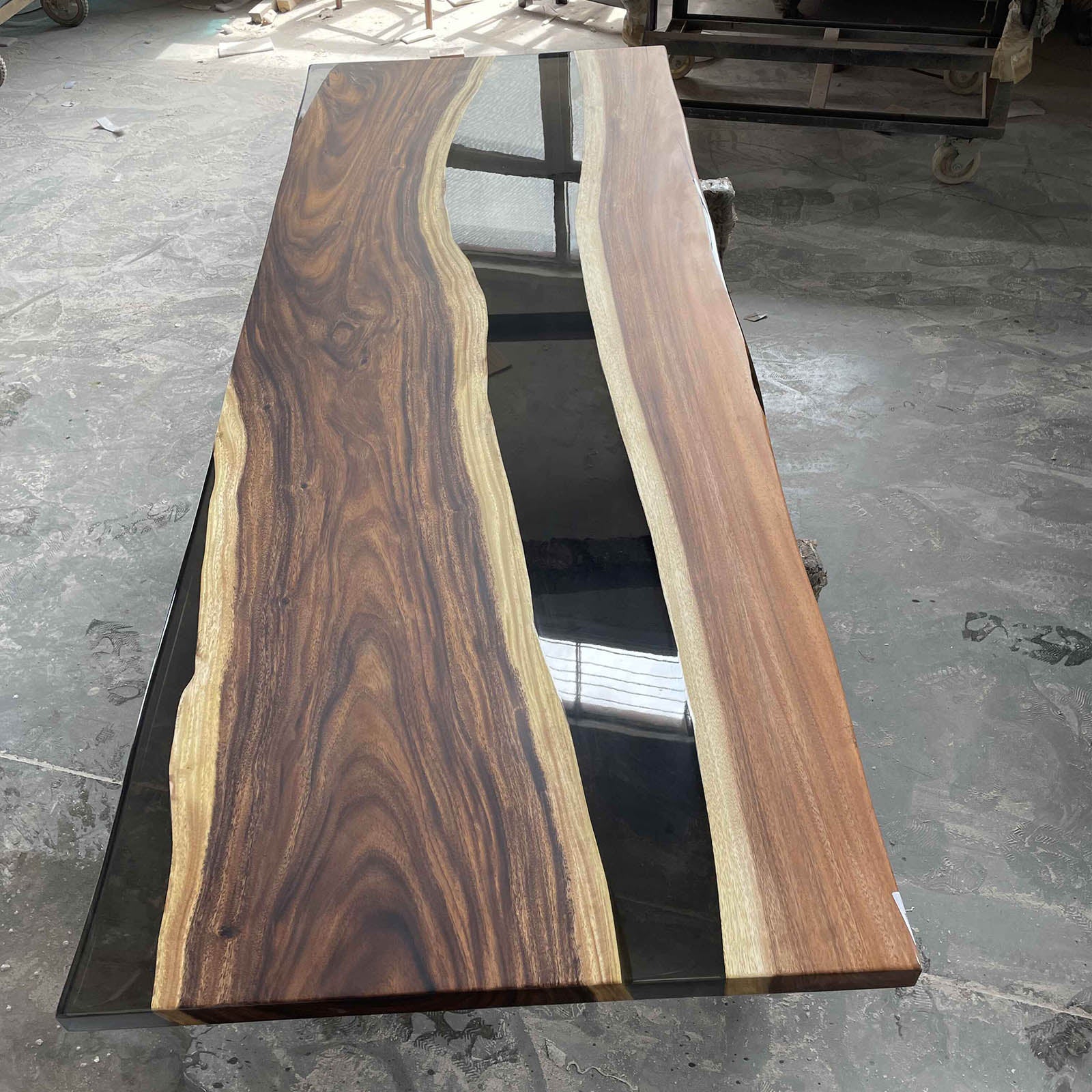 Handcrafted walnut river tabletop with black epoxy, suitable for dining tables, desks, or office tables.