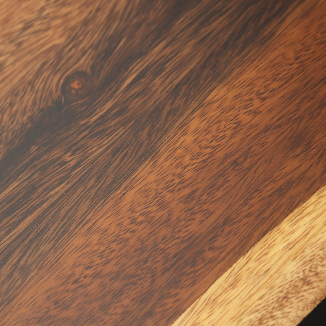 Corner and edge detail of walnut black epoxy river table