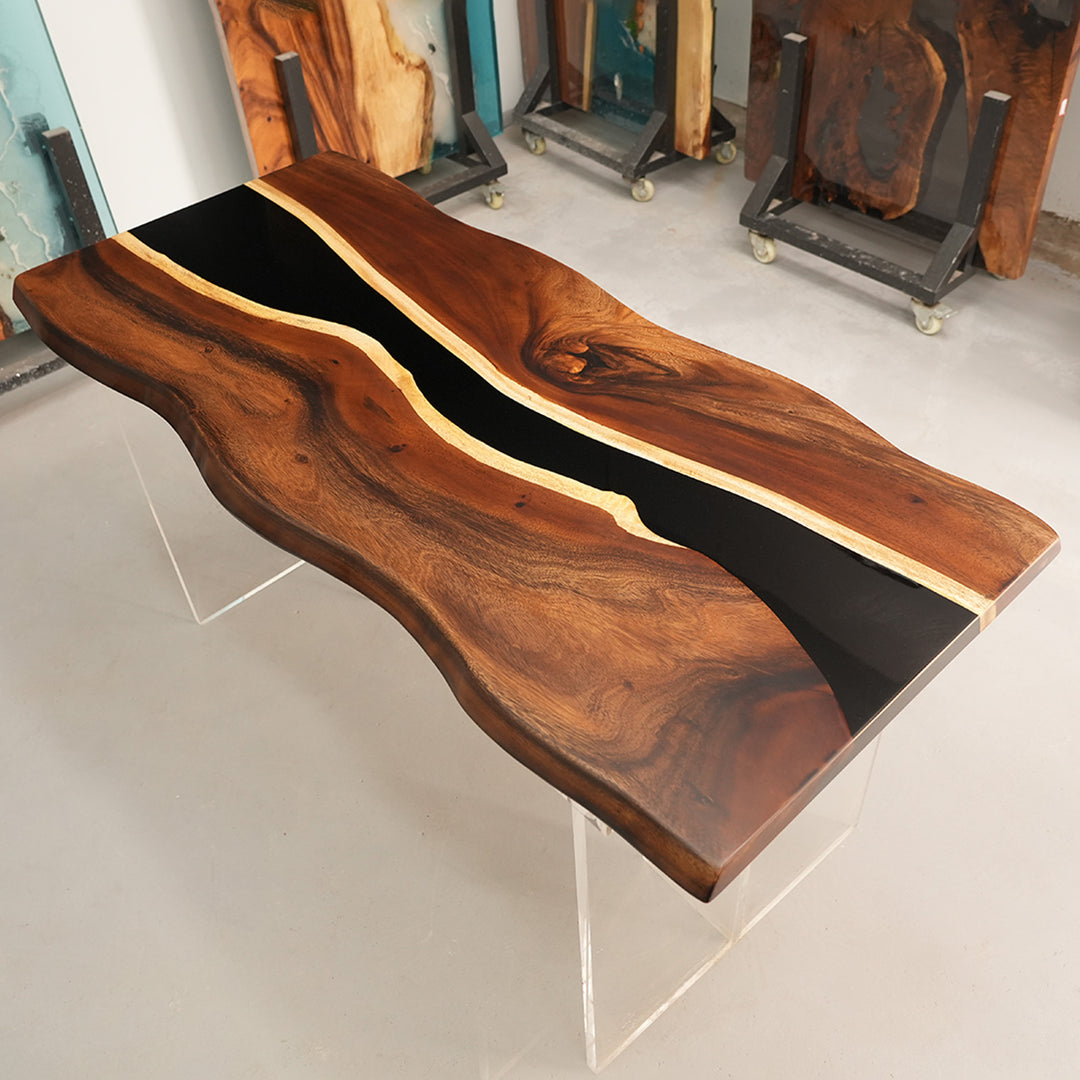Angle view of walnut live-edge black epoxy river table