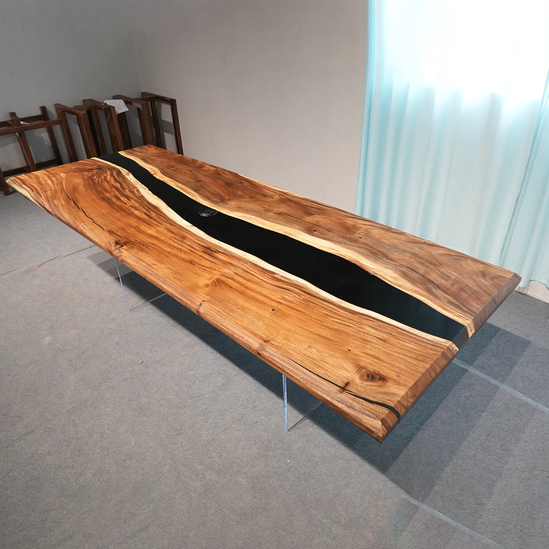 Walnut dining table with an organic black epoxy river by SeawaveTable
