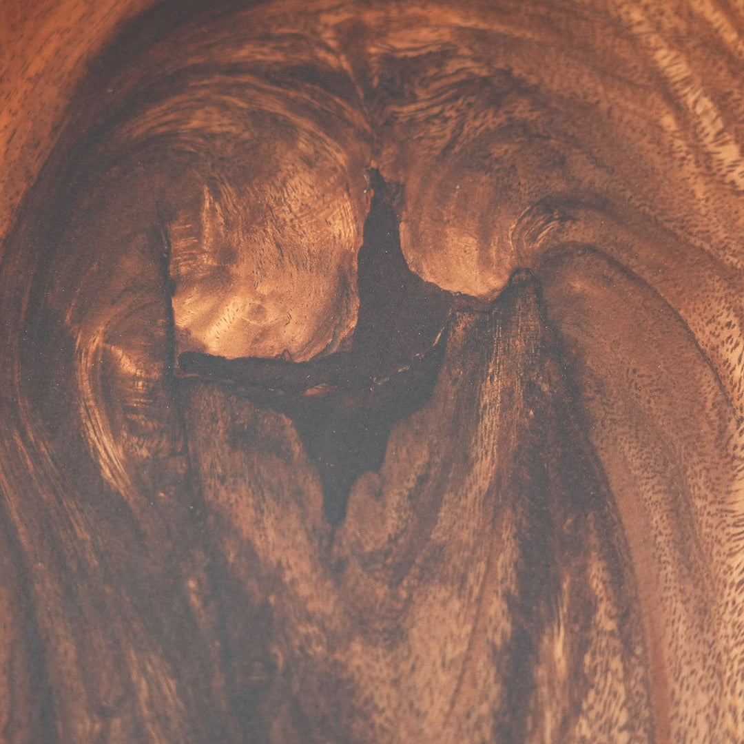 Center detail of black epoxy river flowing through walnut slab