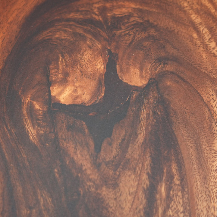 Center detail of black epoxy river flowing through walnut slab