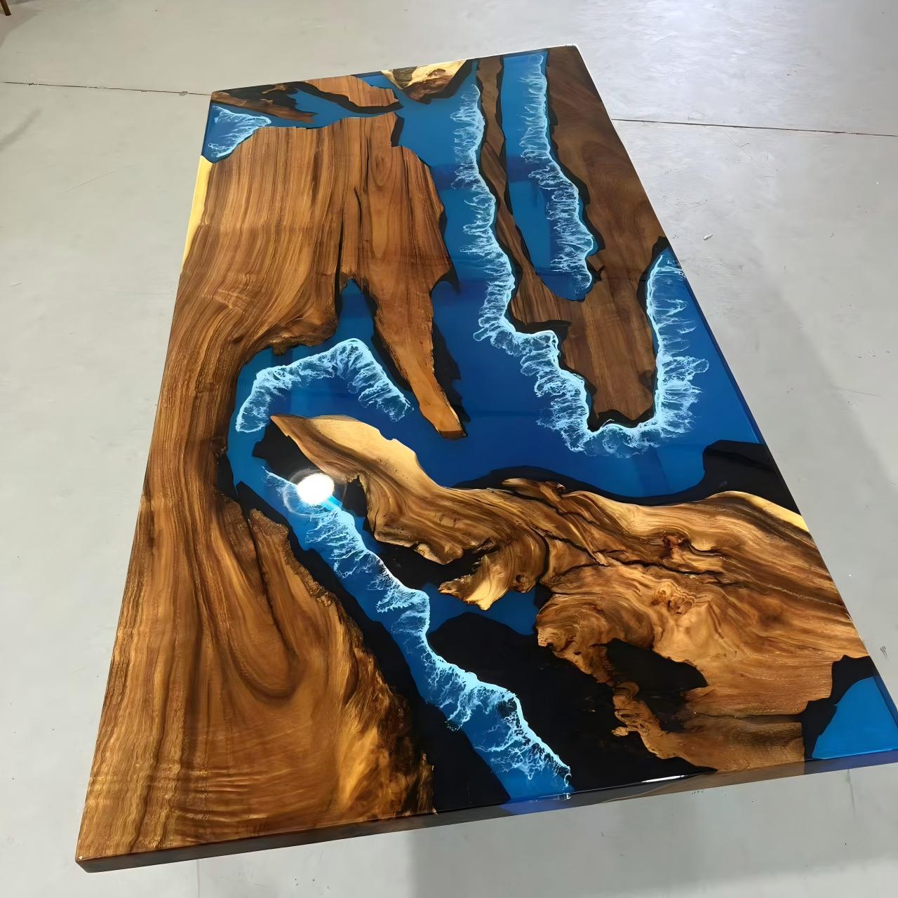Black walnut dining table with transparent blue resin and white wave epoxy accents