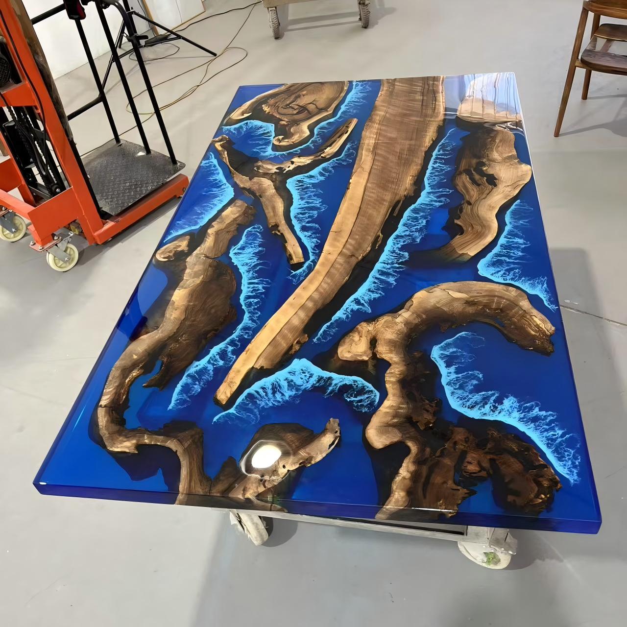 Handmade black walnut table with ocean-inspired blue resin and white wave details