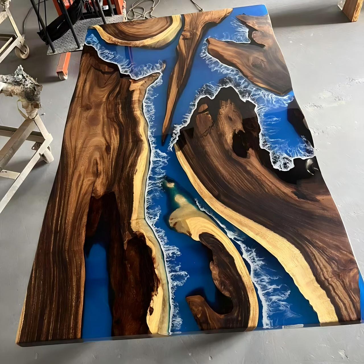 Finished black walnut dining table with deep blue transparent resin and white wave epoxy