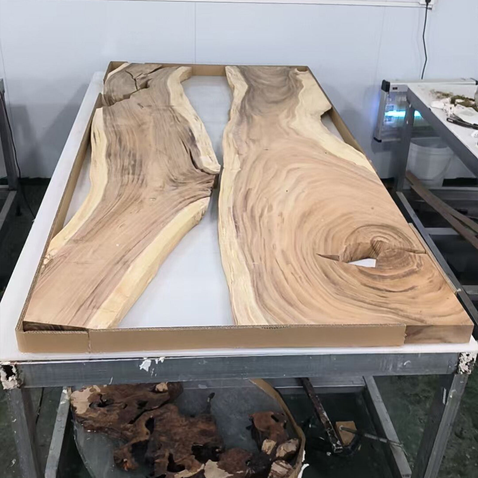 Top view of walnut conference table featuring white sapwood borders and a sleek black epoxy center.