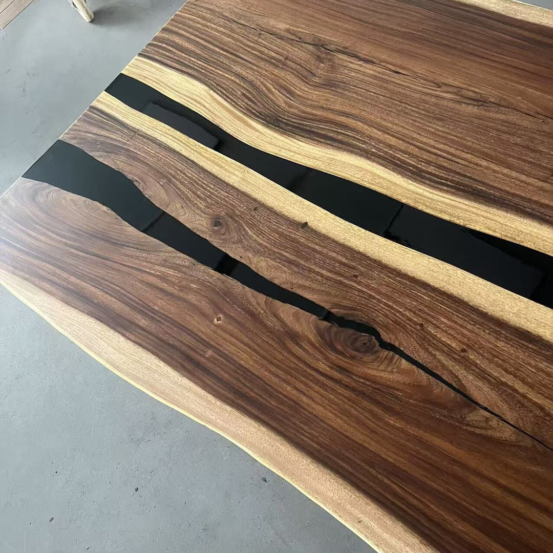 Wooden surface with black resin inlay on a gray floor