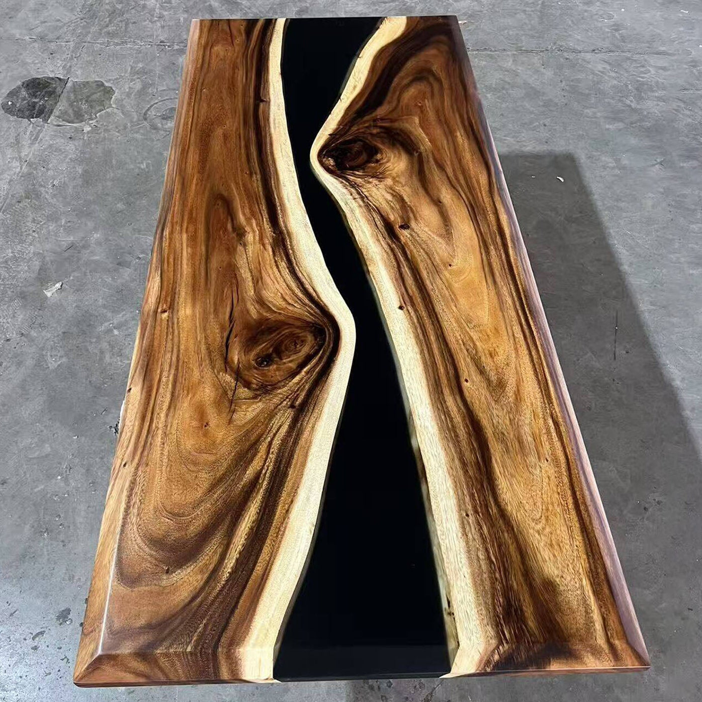 Handmade rectangular walnut tabletop with striking white sapwood edges and black epoxy center river.