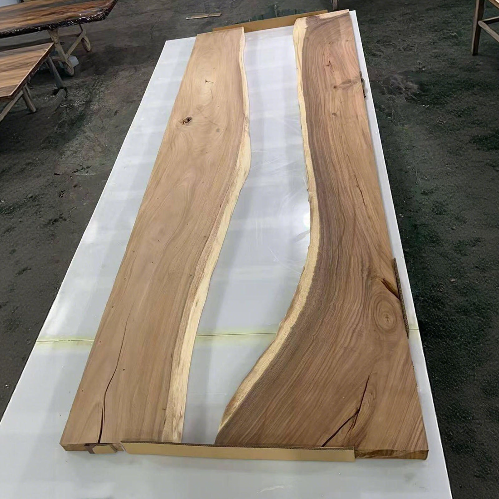 Natural walnut wood grain blending with forest epoxy design